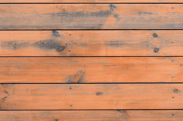 Varnished wood background from cabin exterior. Brown wood barn plank rough grain surface background