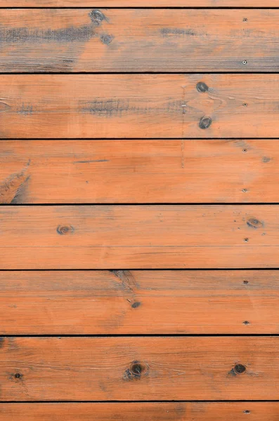 Varnished wood background from cabin exterior. Brown wood barn plank rough grain surface background