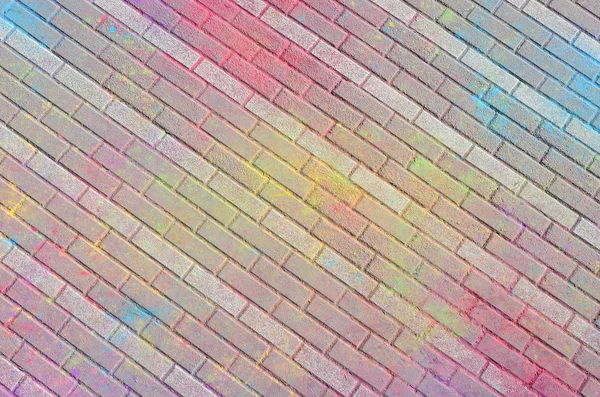 マルチカラーの地球 スラブ 道路舗装 ホーリー祭で乾燥色で塗られる粉をクローズ アップ — ストック写真