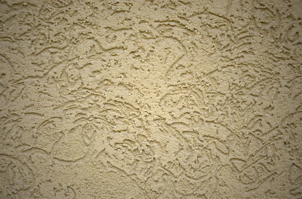 The texture of the beige decorative plaster in bark beetle style. Russian variation of decorating facade walls — Stock Image Texture Beige Decorative Plaster Bark Beetle Style Russian Variation Decorating Stock Photo