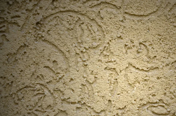 The texture of the beige decorative plaster in bark beetle style. Russian variation of decorating facade walls — Stock Image Texture Beige Decorative Plaster Bark Beetle Style Russian Variation Decorating Royalty Free Stock Photos
