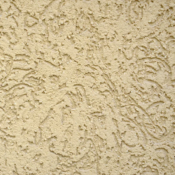 The texture of the beige decorative plaster in bark beetle style. Russian variation of decorating facade walls — Stock Image Texture Beige Decorative Plaster Bark Beetle Style Russian Variation Decorating Royalty Free Stock Photos
