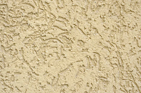 The texture of the beige decorative plaster in bark beetle style. Russian variation of decorating facade walls — Stock Image Texture Beige Decorative Plaster Bark Beetle Style Russian Variation Decorating Stock Image