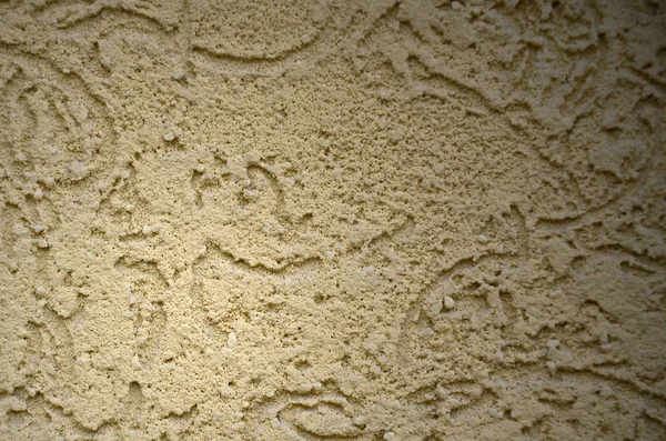 The texture of the beige decorative plaster in bark beetle style. Russian variation of decorating facade walls — Stock Image Texture Beige Decorative Plaster Bark Beetle Style Russian Variation Decorating Royalty Free Stock Images