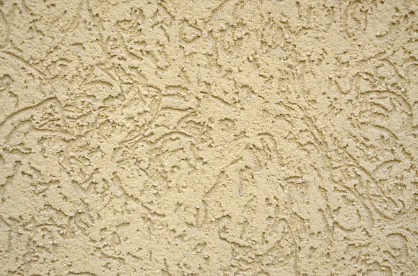 The texture of the beige decorative plaster in bark beetle style. Russian variation of decorating facade walls — Stock Image Texture Beige Decorative Plaster Bark Beetle Style Russian Variation Decorating Stock Image