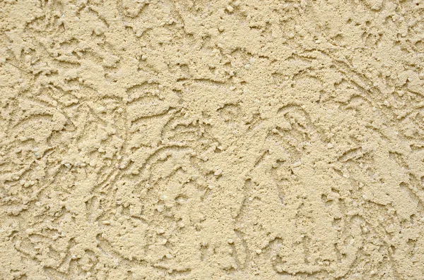 The texture of the beige decorative plaster in bark beetle style. Russian variation of decorating facade walls — Stock Image Texture Beige Decorative Plaster Bark Beetle Style Russian Variation Decorating Stock Photo