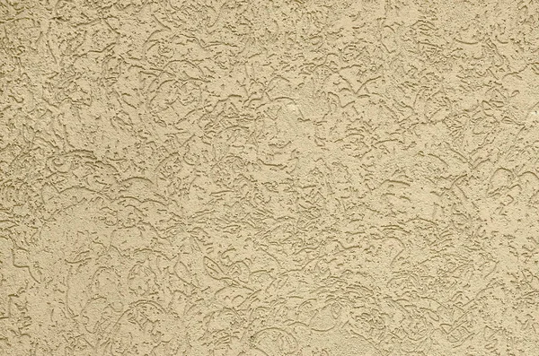 The texture of the beige decorative plaster in bark beetle style. Russian variation of decorating facade walls — Stock Image Texture Beige Decorative Plaster Bark Beetle Style Russian Variation Decorating Stock Photo