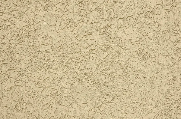 The texture of the beige decorative plaster in bark beetle style. Russian variation of decorating facade walls — Stock Image Texture Beige Decorative Plaster Bark Beetle Style Russian Variation Decorating Stock Picture