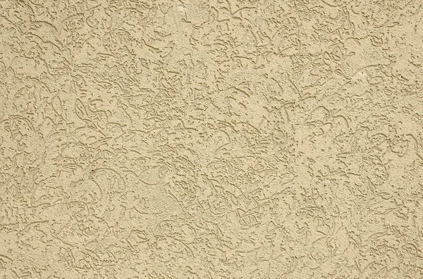 The texture of the beige decorative plaster in bark beetle style. Russian variation of decorating facade walls — Stock Image Texture Beige Decorative Plaster Bark Beetle Style Russian Variation Decorating Stock Picture
