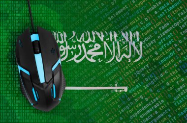 Saudi Arabia flag  and modern backlit computer mouse. The concept of digital threat, illegal actions on the Internet clipart