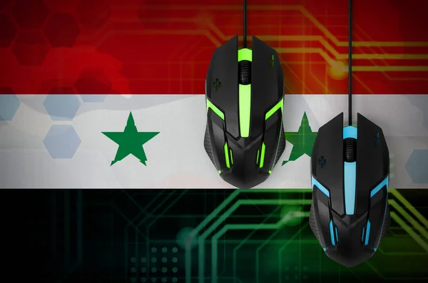 Syria flag  and two modern computer mice with backlight. The concept of online cooperative games. Cyber sport team