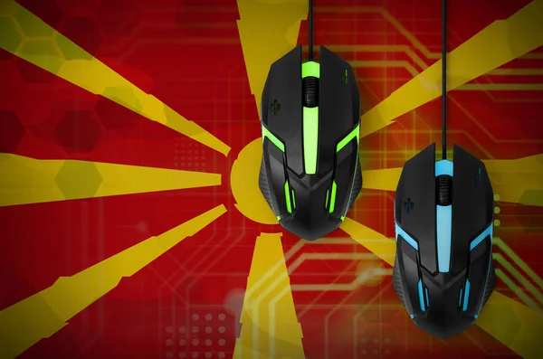 Macedonia flag  and two modern computer mice with backlight. The concept of online cooperative games. Cyber sport team