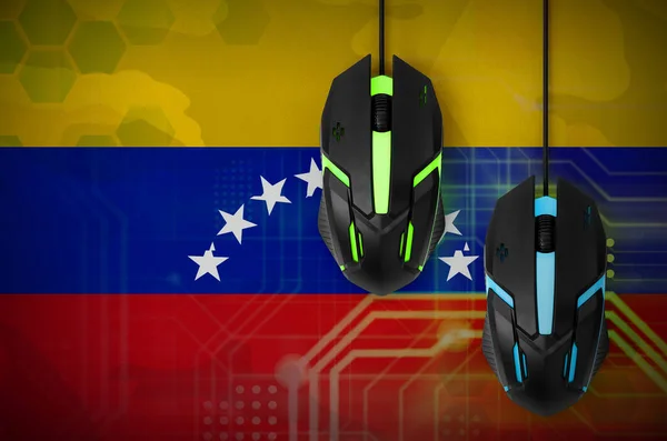 Venezuela flag  and two modern computer mice with backlight. The concept of online cooperative games. Cyber sport team