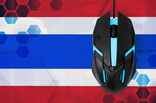 Thailand flag  and modern backlit computer mouse. Concept of country representing e-sports team