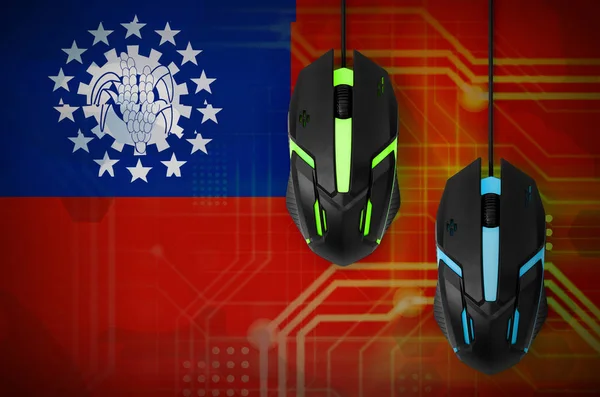 Myanmar flag  and two modern computer mice with backlight. The concept of online cooperative games. Cyber sport team