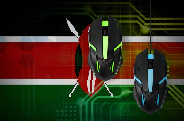 Kenya flag  and two modern computer mice with backlight. The concept of online cooperative games. Cyber sport team