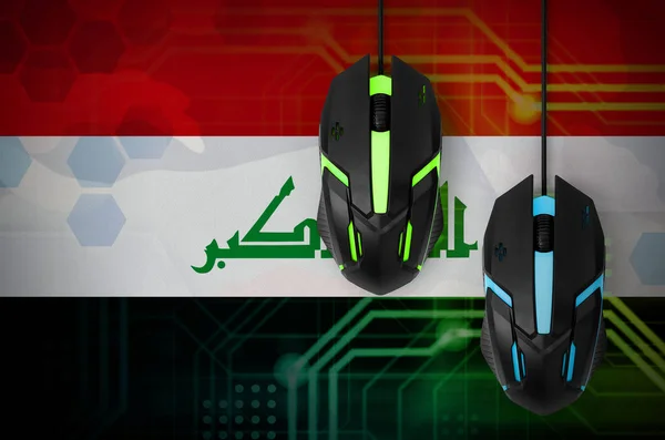 Iraq flag  and two modern computer mice with backlight. The concept of online cooperative games. Cyber sport team
