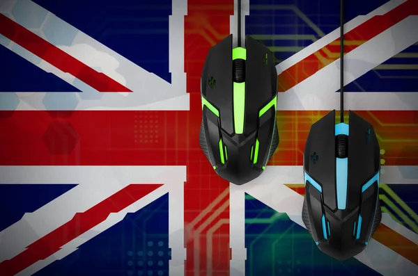 Great britain flag  and two modern computer mice with backlight. The concept of online cooperative games. Cyber sport team