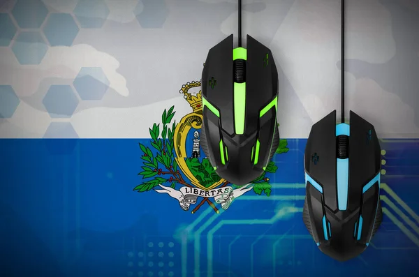 San Marino flag  and two modern computer mice with backlight. The concept of online cooperative games. Cyber sport team