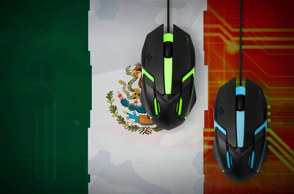 Mexico flag  and two modern computer mice with backlight. The concept of online cooperative games. Cyber sport team