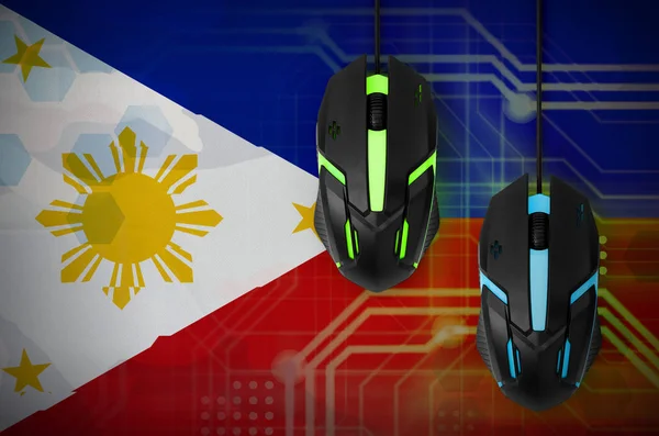 Philippines flag  and two modern computer mice with backlight. The concept of online cooperative games. Cyber sport team