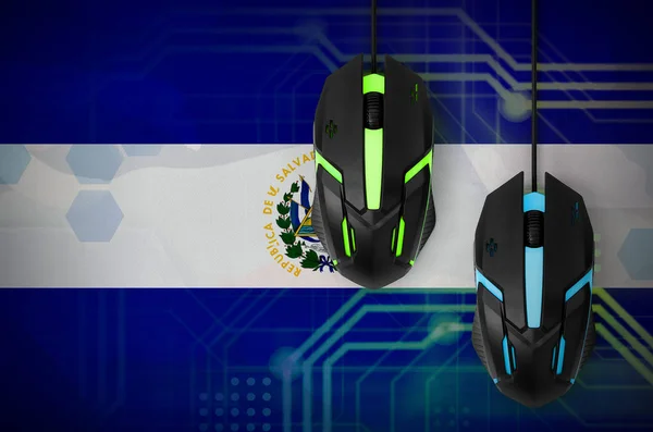 El Salvador flag  and two modern computer mice with backlight. The concept of online cooperative games. Cyber sport team