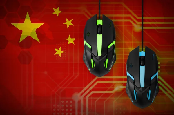 China flag  and two modern computer mice with backlight. The concept of online cooperative games. Cyber sport team