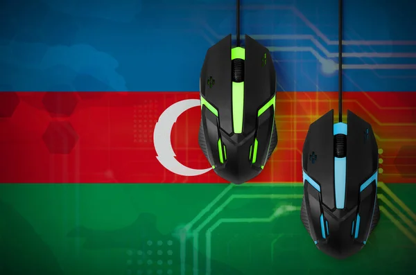 Azerbaijan flag  and two modern computer mice with backlight. The concept of online cooperative games. Cyber sport team
