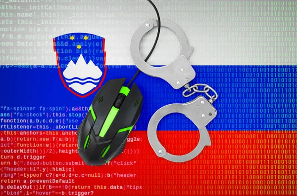 Slovenia flag  and handcuffed modern backlit computer mouse. Creative concept of combating computer crime, hackers and piracy