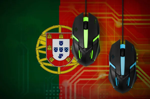Portugal flag  and two modern computer mice with backlight. The concept of online cooperative games. Cyber sport team