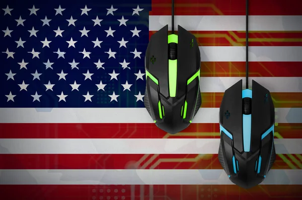 United States of America flag  and two modern computer mice with backlight. The concept of online cooperative games. Cyber sport team