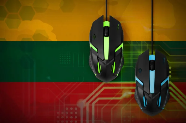 Lithuania flag  and two modern computer mice with backlight. The concept of online cooperative games. Cyber sport team