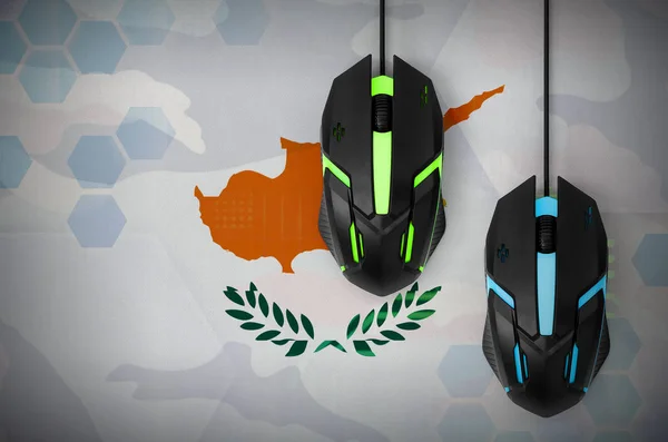Cyprus flag  and two modern computer mice with backlight. The concept of online cooperative games. Cyber sport team