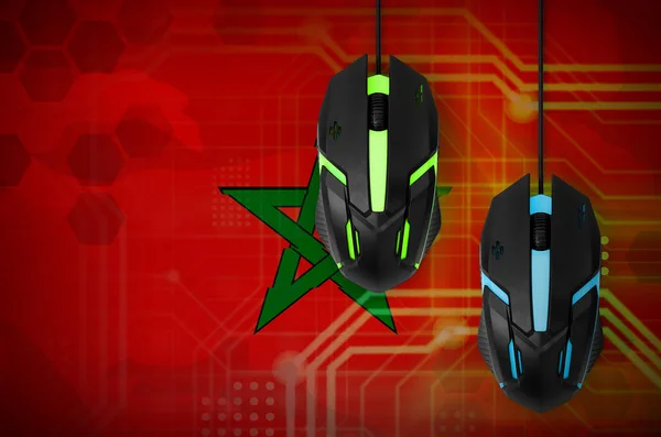 Morocco flag  and two modern computer mice with backlight. The concept of online cooperative games. Cyber sport team