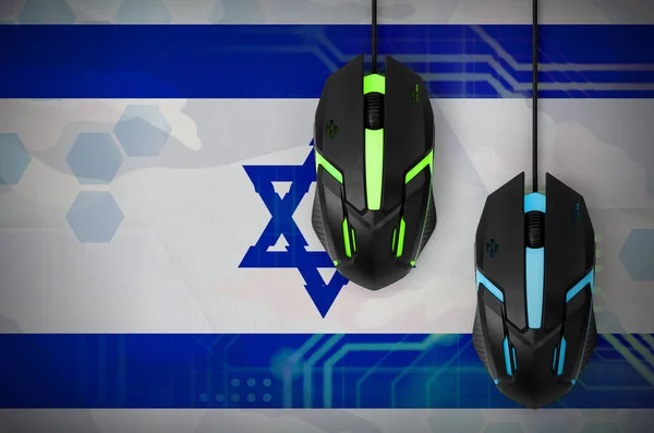 Israel flag  and two modern computer mice with backlight. The concept of online cooperative games. Cyber sport team
