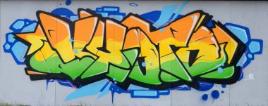 Konturlar ve gölgeleme yakın ile renkli sokak sanatı grafiti resimlerinin parçası. Gençlik çağdaş sanat kültürünün arka plan dokusu. Turuncu sarı ve yeşil renkler