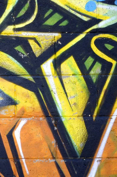 輪郭とシェーディングがクローズアップされた色付きのストリートアートの落書き絵の断片 青少年現代美術文化の背景テクスチャー イエローオレンジとブラウン — ストック写真