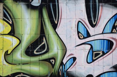 Konturlar ve gölgeleme yakın ile renkli sokak sanatı grafiti resimlerinin parçası. Gençlik çağdaş sanat kültürünün arka plan dokusu. Yeşil sarı renkler
