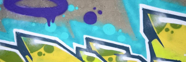 輪郭とシェーディングがクローズアップされた色付きのストリートアートの落書き絵の断片 青少年現代美術文化の背景テクスチャー 緑と黄色の色 — ストック写真