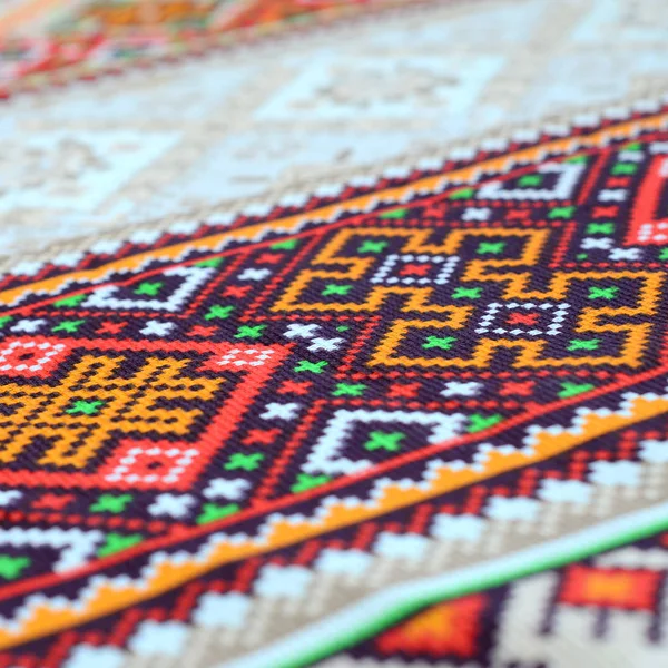 Traditional Ukrainian folk art knitted embroidery pattern on textile fabric — Stock Photo, Image