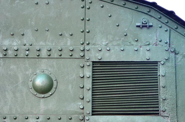 Abstract green industrial metal textured background with rivets and bolts