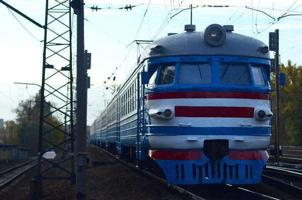 Old soviet electric train with outdated design moving by rail — Stock Photo, Image