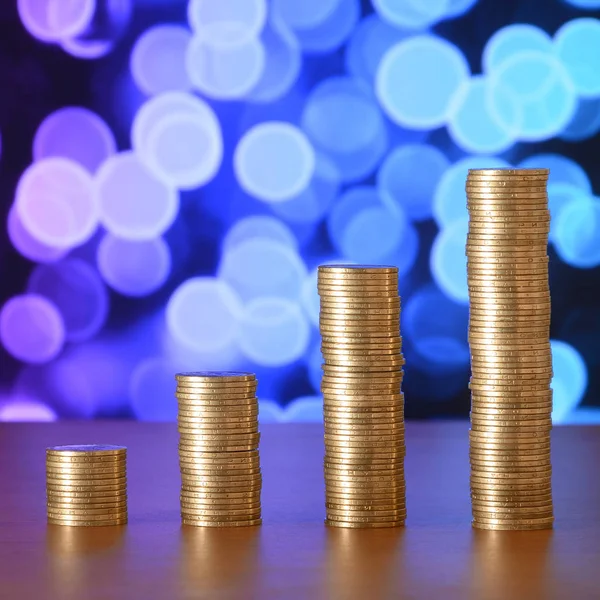 Golden coin stacks arranged as a graph. Increasing columns of coins