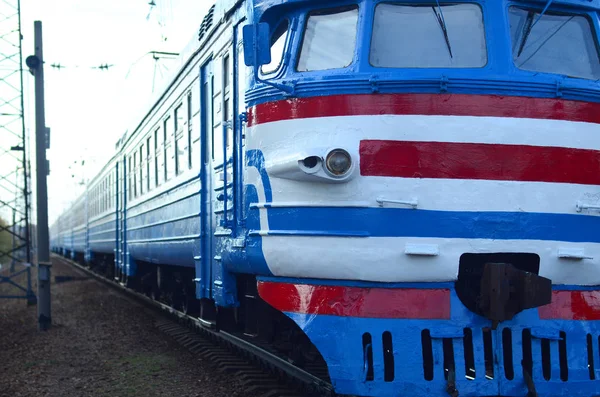 Old soviet electric train with outdated design moving by rail — Stock Photo, Image