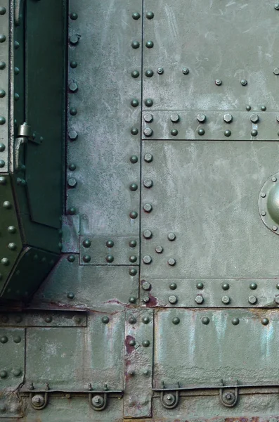 Abstract green industrial metal textured background with rivets and bolts