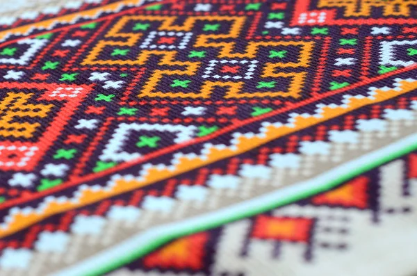 Traditional Ukrainian folk art knitted embroidery pattern on textile fabric — Stock Photo, Image