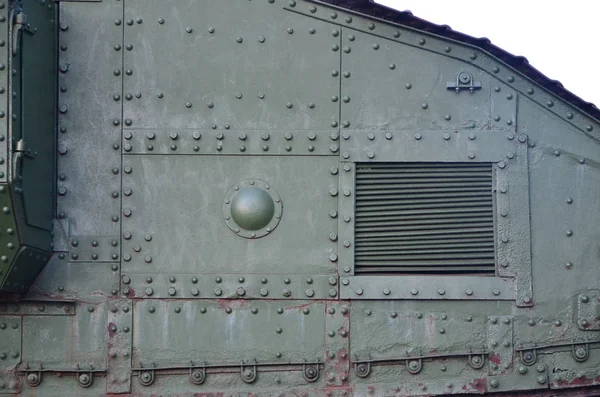 Texture of tank side wall, made of metal and reinforced with a multitude of bolts and rivets — Stock Photo, Image