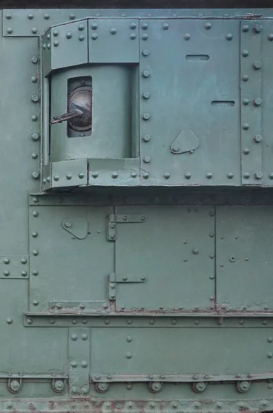 Texture of tank side wall, made of metal and reinforced with a multitude of bolts and rivets — Stock Photo, Image