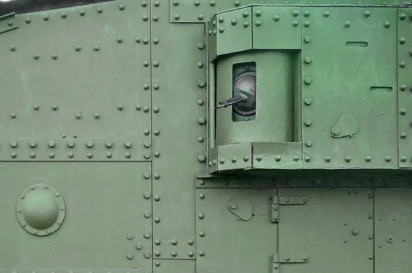 Texture of tank side wall, made of metal and reinforced with a multitude of bolts and rivets — Stock Photo, Image