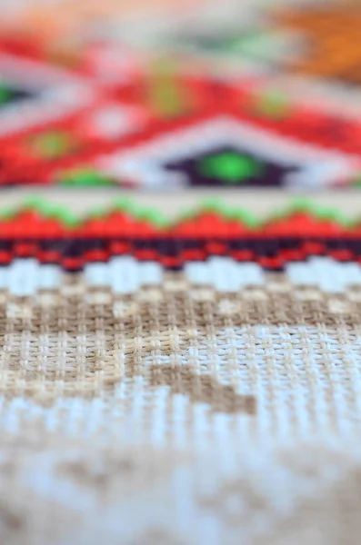 Traditional Ukrainian folk art knitted embroidery pattern on textile fabric